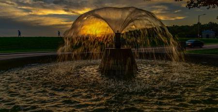 Fountain in front of sunset